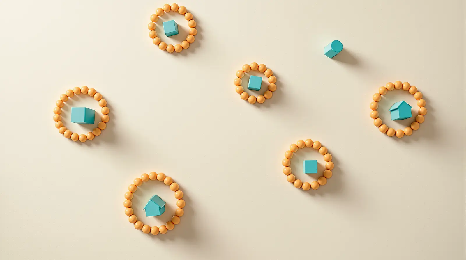 A high view of the big table with several rings of beads far apart, each with a small construction inside.